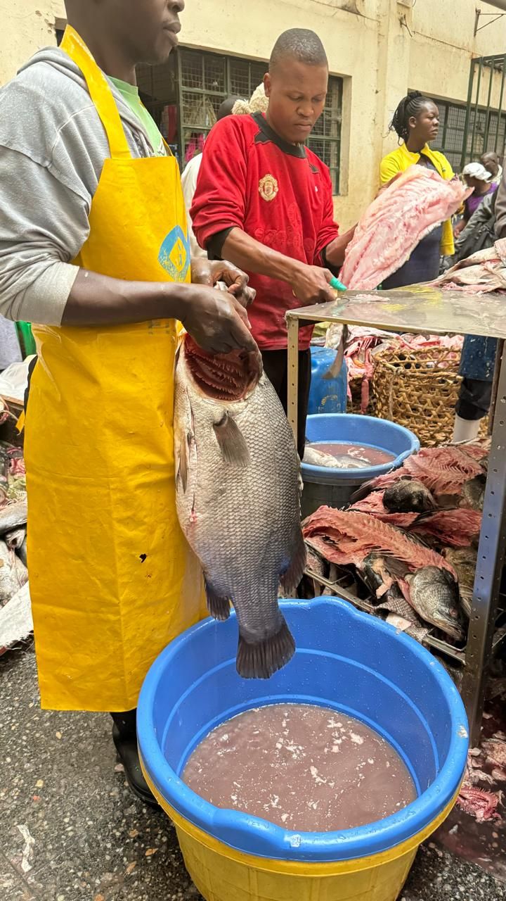 Woman fish trader at a market stall in Kenya